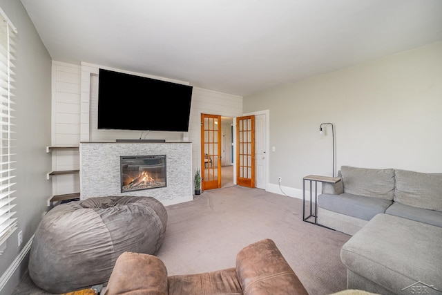 8603 Millington Rd, Vassar, MI 48768 - carpeted living room featuring a tile fireplace and baseboards