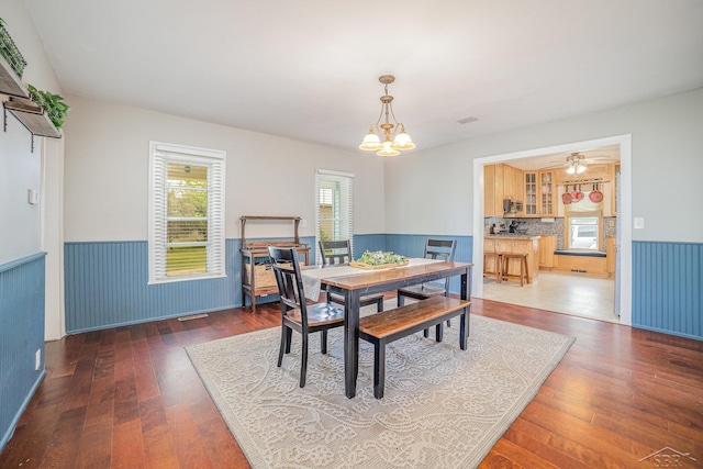 8603 Millington Rd, Vassar, MI 48768 - dining room featuring wainscoting, a chandelier, and wood-type flooring