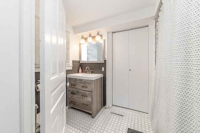 8603 Millington Rd, Vassar, MI 48768 - bathroom featuring vanity and a wainscoted wall