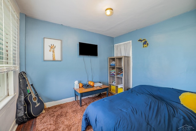 8603 Millington Rd, Vassar, MI 48768 - bedroom featuring baseboards