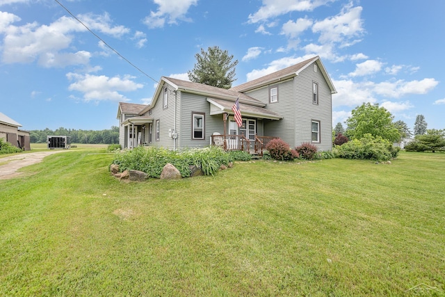 8603 Millington Rd, Vassar, MI 48768 - view of front facade featuring a front yard, a deck, and a shingled roof