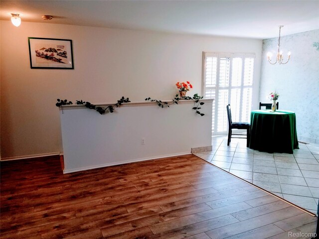 50102 S Benny Ct, New Baltimore, MI 48047 - dining room with a chandelier and wood finished floors