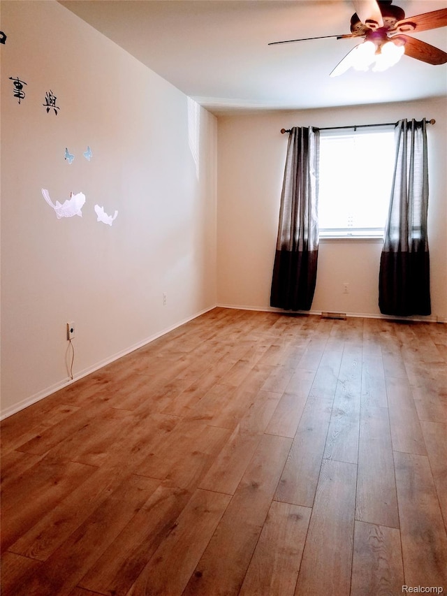 50102 S Benny Ct, New Baltimore, MI 48047 - spare room featuring a ceiling fan and wood finished floors