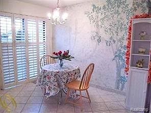 50102 S Benny Ct, New Baltimore, MI 48047 - tiled dining space with a chandelier