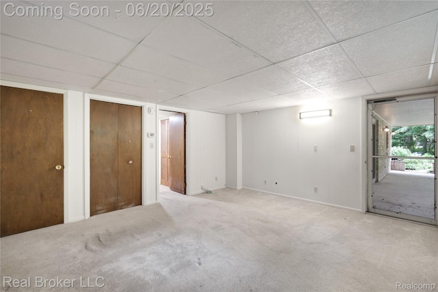 5492 N Sycamore Dr, Burton, MI 48509 - unfurnished room featuring a drop ceiling and carpet flooring