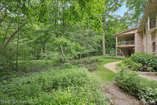 5492 N Sycamore Dr, Burton, MI 48509 - view of yard featuring a balcony