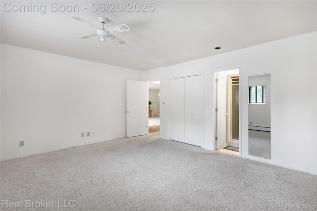 5492 N Sycamore Dr, Burton, MI 48509 - unfurnished bedroom with carpet floors and a baseboard heating unit