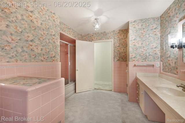 5492 N Sycamore Dr, Burton, MI 48509 - full bath featuring wallpapered walls, tile walls, a wainscoted wall, and vanity