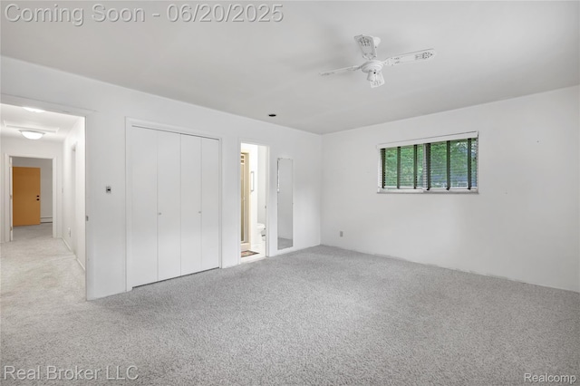 5492 N Sycamore Dr, Burton, MI 48509 - unfurnished bedroom with carpet, a closet, and a ceiling fan