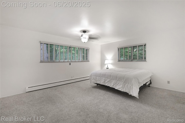 5492 N Sycamore Dr, Burton, MI 48509 - carpeted bedroom with a baseboard radiator and multiple windows