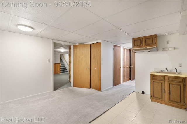 5492 N Sycamore Dr, Burton, MI 48509 - finished basement with stairway, a drop ceiling, and light carpet