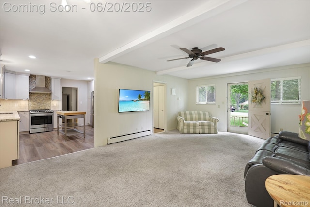 5492 N Sycamore Dr, Burton, MI 48509 - carpeted living room with baseboard heating, a ceiling fan, beamed ceiling, and recessed lighting