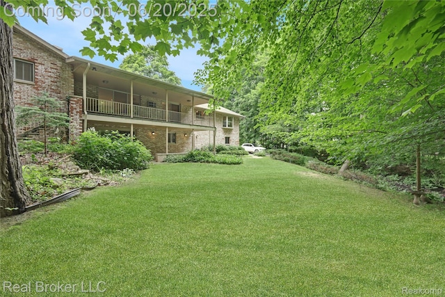 5492 N Sycamore Dr, Burton, MI 48509 - view of green lawn with a balcony