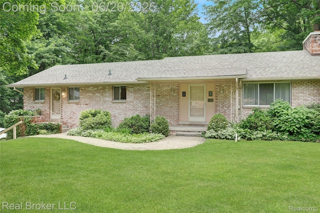5492 N Sycamore Dr, Burton, MI 48509 - ranch-style home with a front lawn, brick siding, roof with shingles, and a chimney