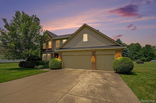15740 Aspen Dr, Romulus, MI 48174 - traditional-style home with brick siding, concrete driveway, and a lawn