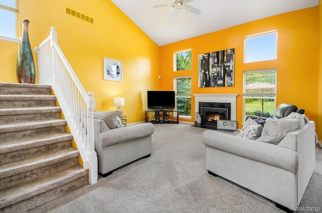 15740 Aspen Dr, Romulus, MI 48174 - living room featuring high vaulted ceiling, carpet floors, a ceiling fan, stairway, and a fireplace