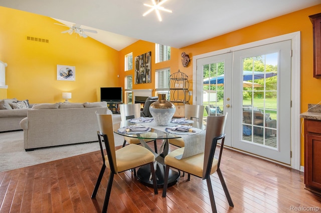 15740 Aspen Dr, Romulus, MI 48174 - dining space featuring healthy amount of natural light, hardwood / wood-style floors, and vaulted ceiling