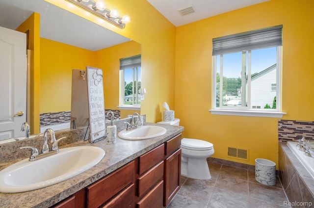 15740 Aspen Dr, Romulus, MI 48174 - full bath featuring a bath, double vanity, and healthy amount of natural light