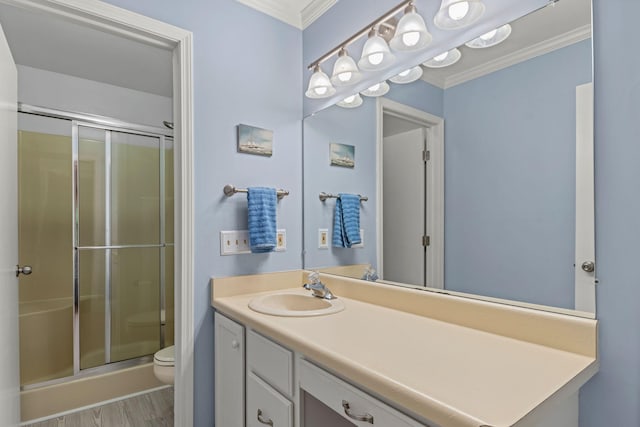 749 Foxboro Ct, Saline, MI 48176 - bathroom with ornamental molding, vanity, a shower stall, and wood finished floors