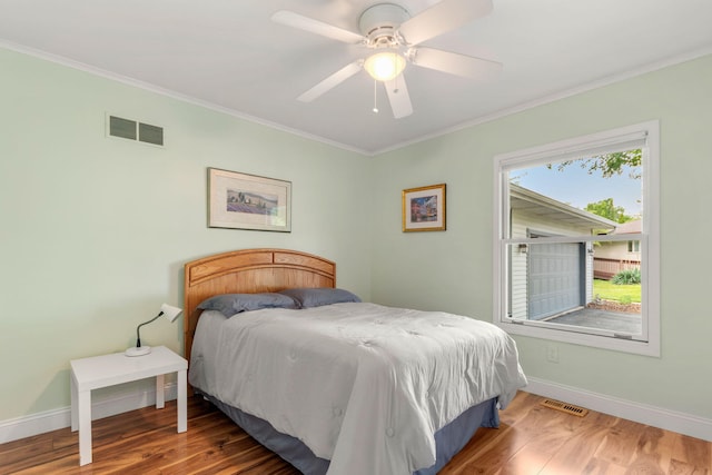 749 Foxboro Ct, Saline, MI 48176 - bedroom featuring crown molding, wood finished floors, and a ceiling fan