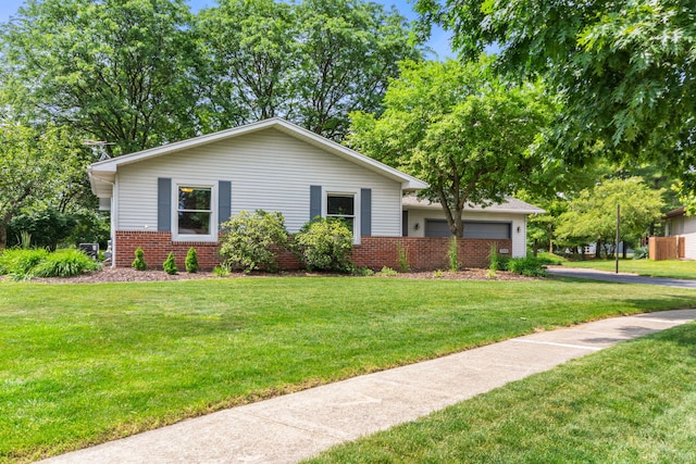 749 Foxboro Ct, Saline, MI 48176 - view of front facade with an attached garage, brick siding, and a front yard