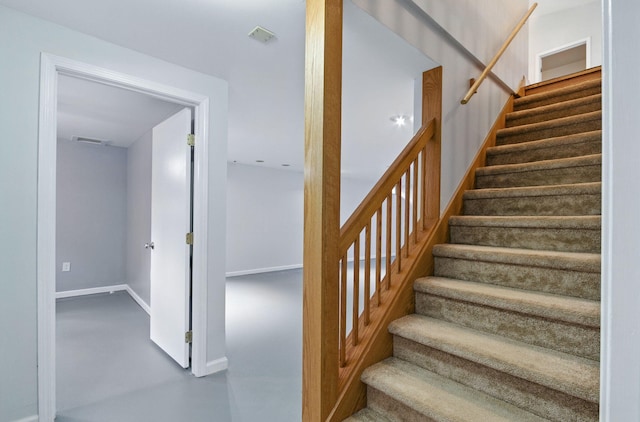 749 Foxboro Ct, Saline, MI 48176 - stairway with finished concrete flooring and baseboards