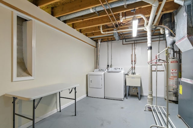 749 Foxboro Ct, Saline, MI 48176 - unfinished below grade area featuring washing machine and clothes dryer and gas water heater