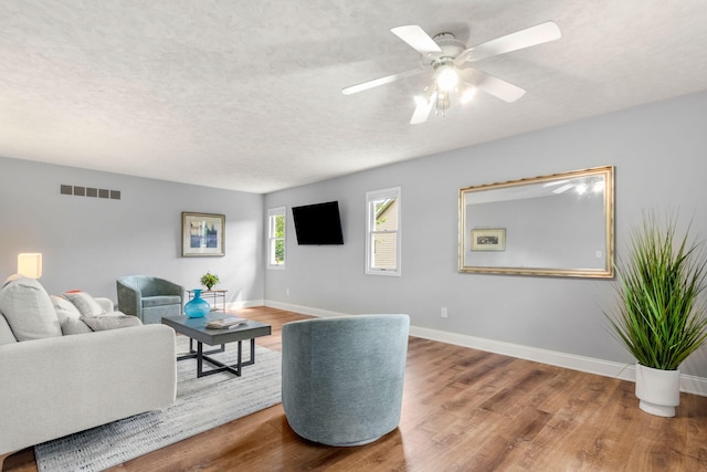 749 Foxboro Ct, Saline, MI 48176 - living room with a textured ceiling, ceiling fan, and wood finished floors