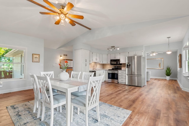 749 Foxboro Ct, Saline, MI 48176 - dining room featuring ceiling fan, light wood finished floors, and lofted ceiling