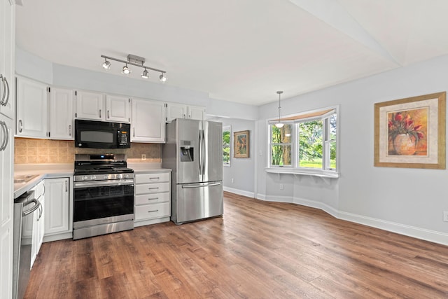 749 Foxboro Ct, Saline, MI 48176 - kitchen featuring stainless steel appliances, light countertops, decorative backsplash, white cabinetry, and wood finished floors