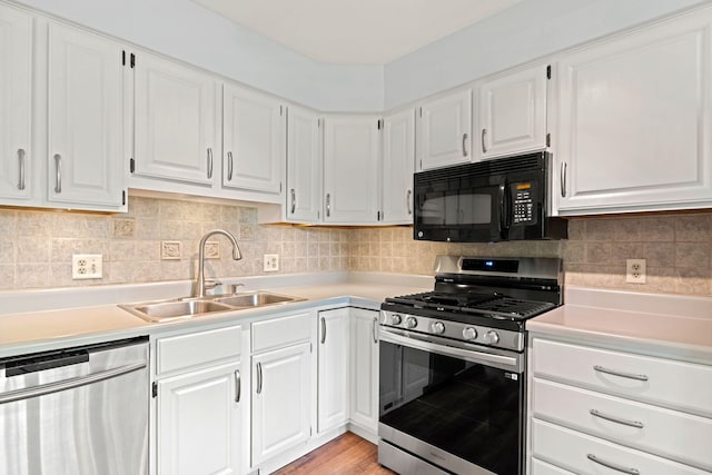 749 Foxboro Ct, Saline, MI 48176 - kitchen featuring appliances with stainless steel finishes, light countertops, and white cabinets