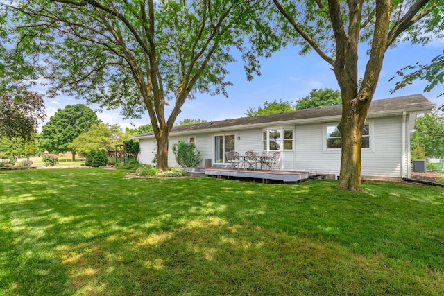 749 Foxboro Ct, Saline, MI 48176 - back of property featuring a wooden deck and a lawn