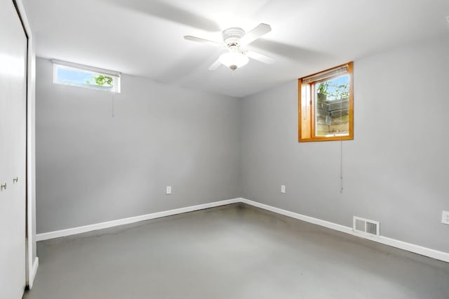 749 Foxboro Ct, Saline, MI 48176 - unfurnished room featuring concrete flooring, healthy amount of natural light, and a ceiling fan