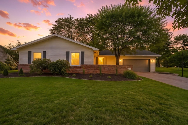 749 Foxboro Ct, Saline, MI 48176 - ranch-style house featuring concrete driveway, a garage, a lawn, and brick siding