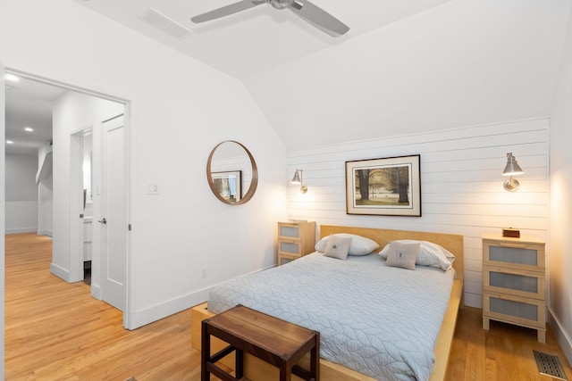 9435 Community Hall Rd, Union Pier, MI 49129 - bedroom with wood finished floors, a ceiling fan, wooden walls, and lofted ceiling