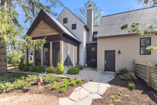 9435 Community Hall Rd, Union Pier, MI 49129 - view of front of property with a sunroom and a chimney