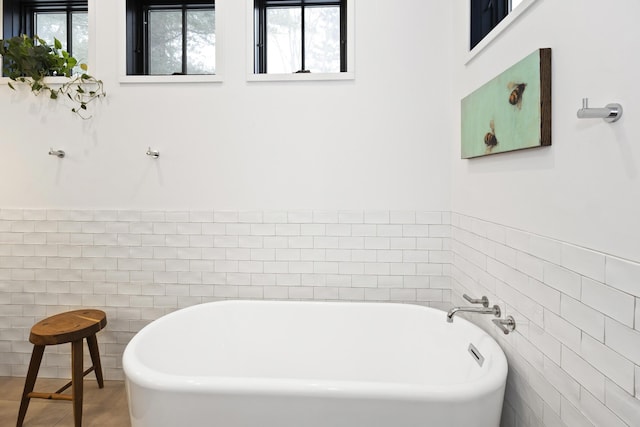 9435 Community Hall Rd, Union Pier, MI 49129 - full bathroom with a freestanding tub and tile walls