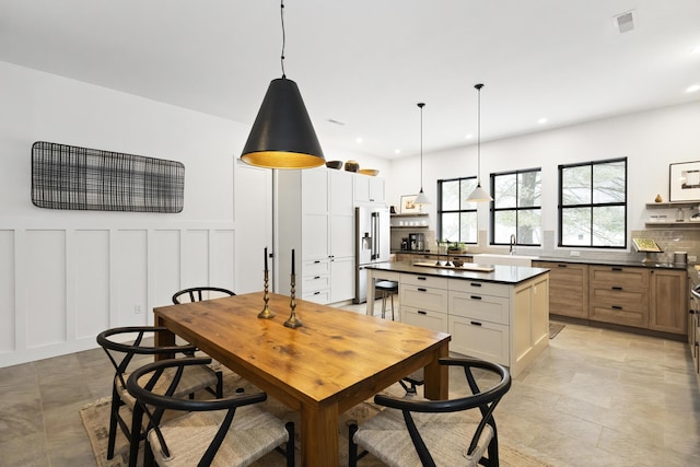 9435 Community Hall Rd, Union Pier, MI 49129 - dining space featuring a decorative wall, recessed lighting, and wainscoting