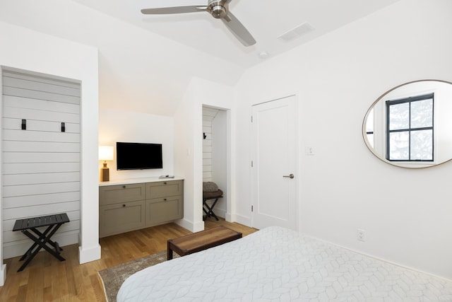 9435 Community Hall Rd, Union Pier, MI 49129 - bedroom with light wood finished floors, lofted ceiling, and a ceiling fan