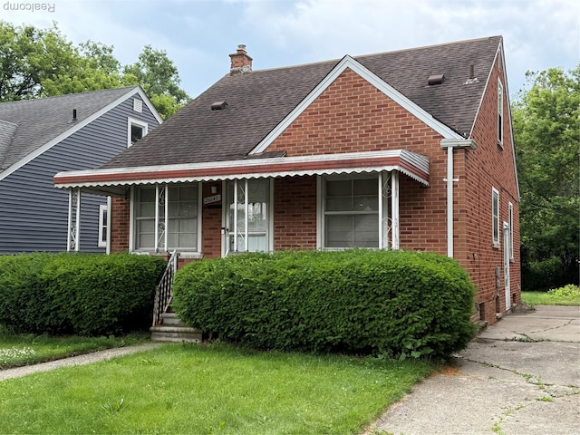 26645 Ross St, Inkster, MI 48141 - bungalow featuring brick siding, a chimney, and roof with shingles