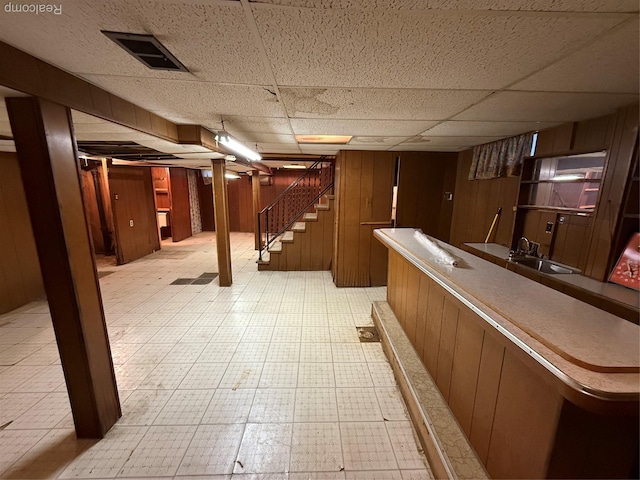 26645 Ross St, Inkster, MI 48141 - finished basement with light flooring, stairs, a drop ceiling, bar area, and wood walls