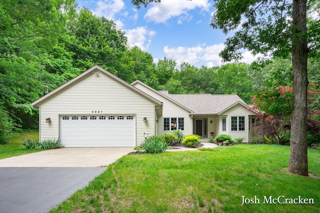 3221 Bewell Ave SE, Lowell, MI 49331 - ranch-style house with a garage, driveway, a front lawn, and roof with shingles