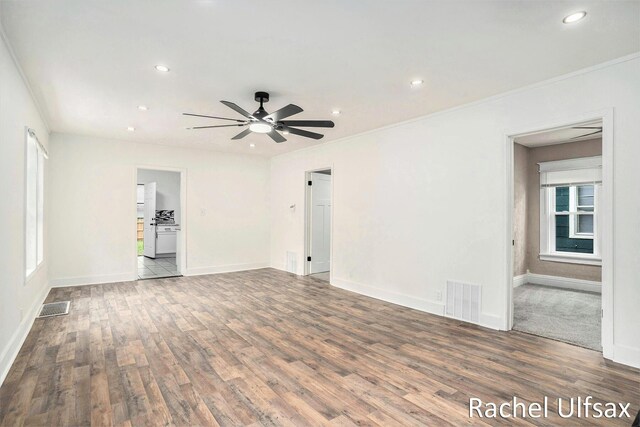 1676 Dyson St, Muskegon, MI 49442 - unfurnished room with wood finished floors, recessed lighting, a ceiling fan, and crown molding