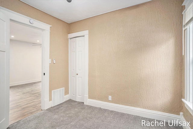1676 Dyson St, Muskegon, MI 49442 - unfurnished bedroom with a closet and carpet floors