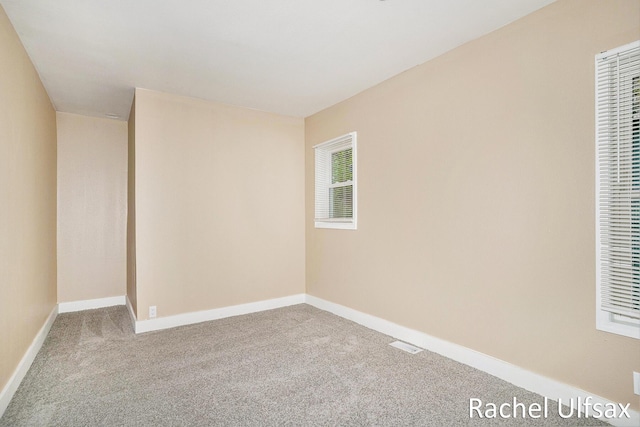 1676 Dyson St, Muskegon, MI 49442 - carpeted empty room with baseboards