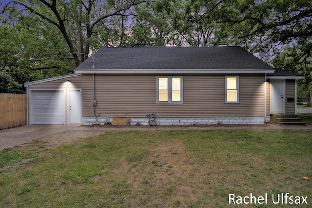 1676 Dyson St, Muskegon, MI 49442 - view of home's exterior with driveway, roof with shingles, an attached garage, and crawl space