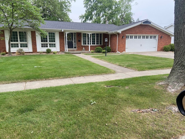 52 W Miller Ave, Milan, MI 48160 - ranch-style house with brick siding, an attached garage, a front yard, concrete driveway, and a shingled roof