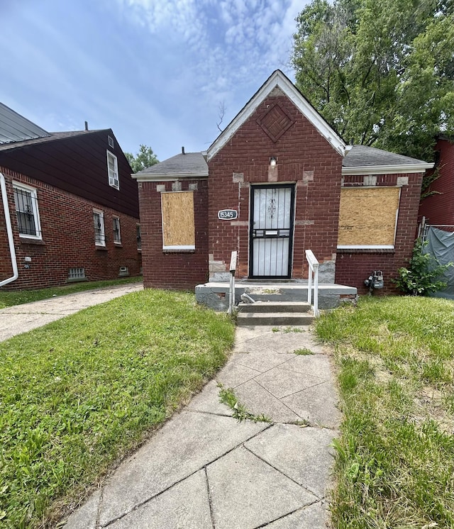 15345 Marlowe St, Detroit, MI 48227 - bungalow-style house featuring brick siding and a front lawn