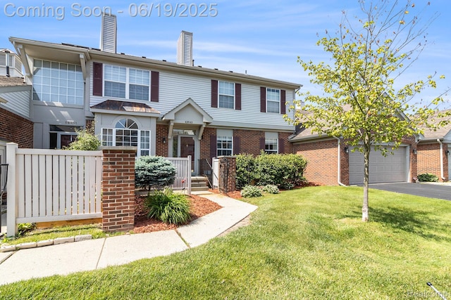 49649 Draper Cir, Plymouth, MI 48170 - townhome / multi-family property featuring brick siding, driveway, and a chimney
