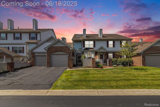 49649 Draper Cir, Plymouth, MI 48170 - view of property featuring asphalt driveway, brick siding, a garage, and a chimney